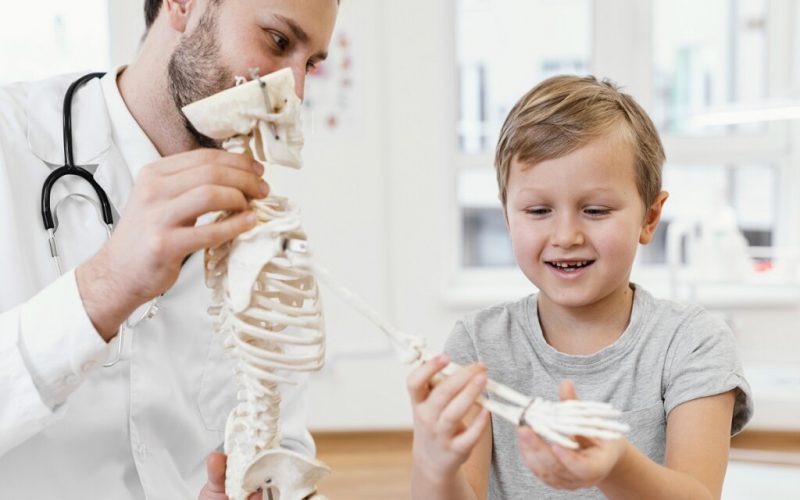 close up doctor kid with skeleton 1024xauto Dadsbanter