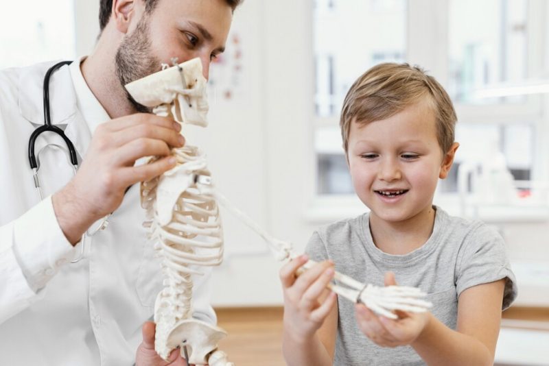 close up doctor kid with skeleton 1024xauto Dadsbanter