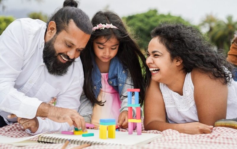 indian parents having fun city park playing with wood toys with their daughter 1160x729 1024xauto Dadsbanter